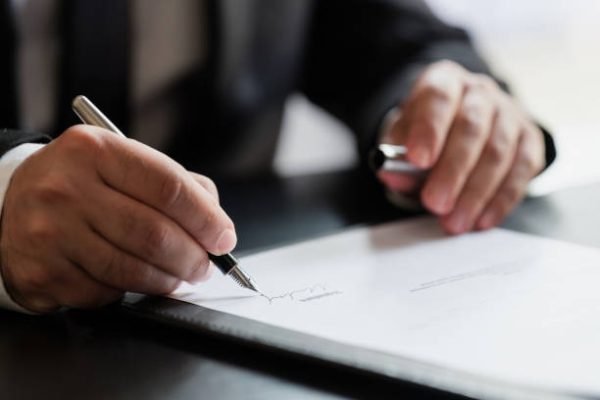 Crypto blockchain attorney reviewing token sale documents
