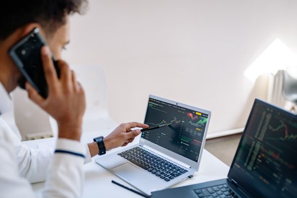 Cryptocurrency fraud attorney reviewing fake trading platform evidence