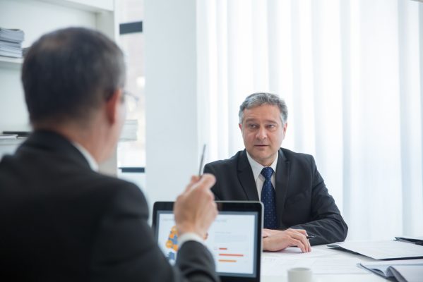International wire fraud recovery lawyer reviewing cross-border financial transactions
